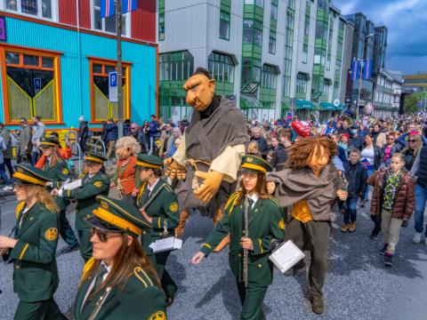 Tufti, along with a brass band and national holiday guests, in a parade on June 17, 2022.