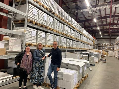 City staff with stacks of drawings