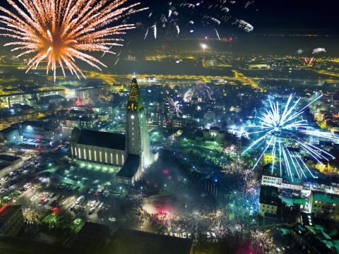 Fireworks. Aerial view of Hallgrímskirkja and surrounding areas.