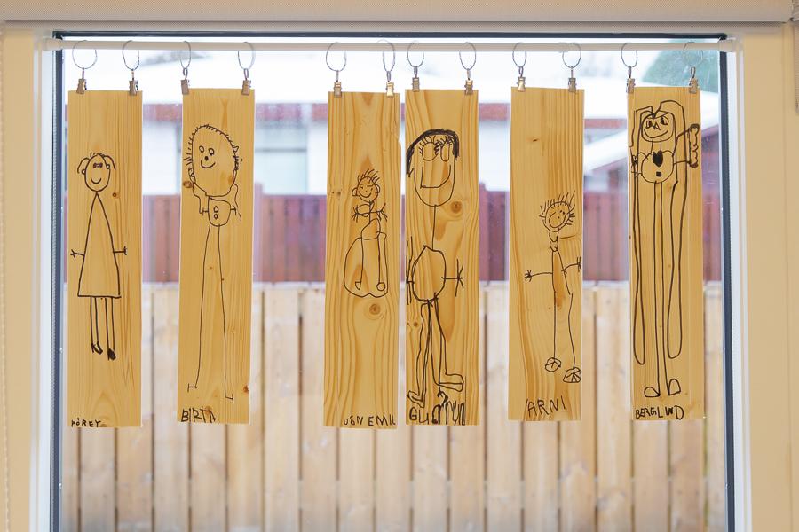 Student artwork displayed in a window at Kvistaborg.
