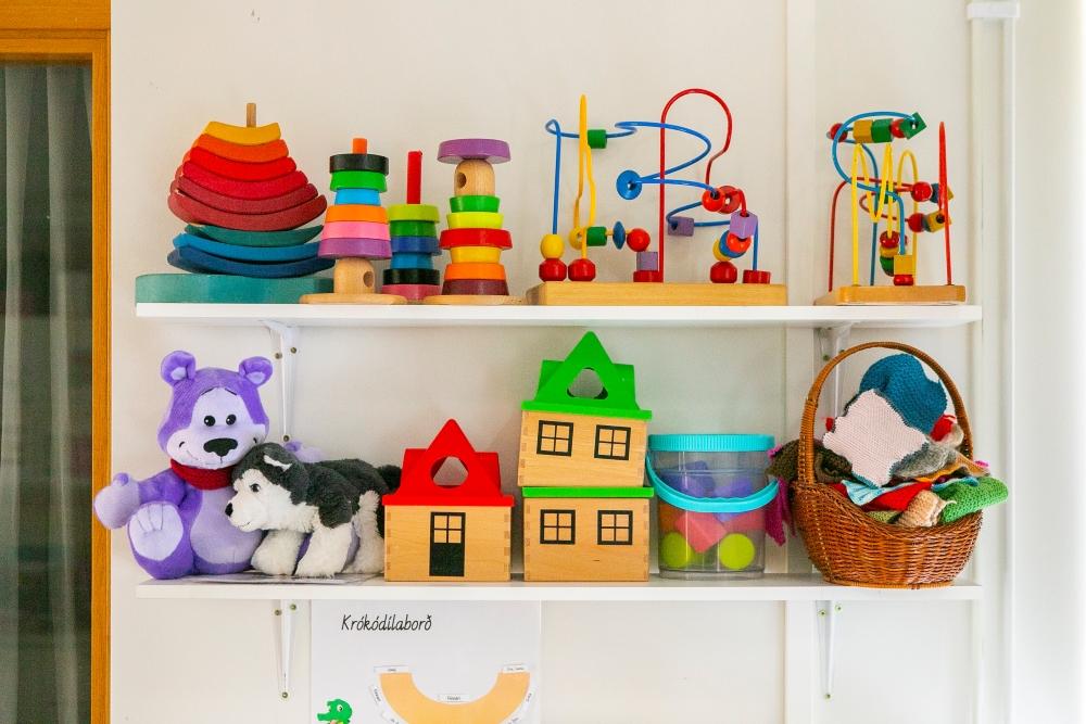 Shelf with educational toys and plushies