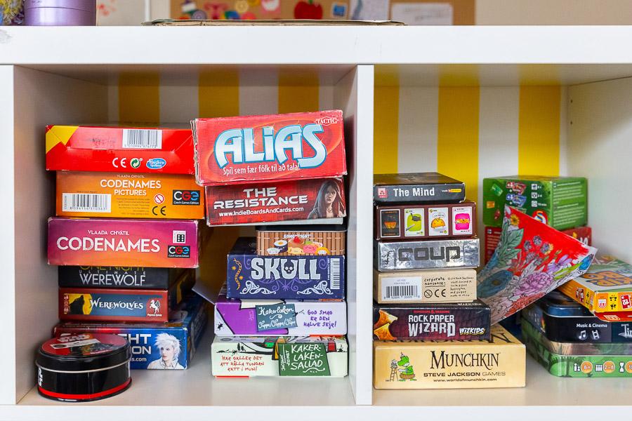 Various games on a shelf.