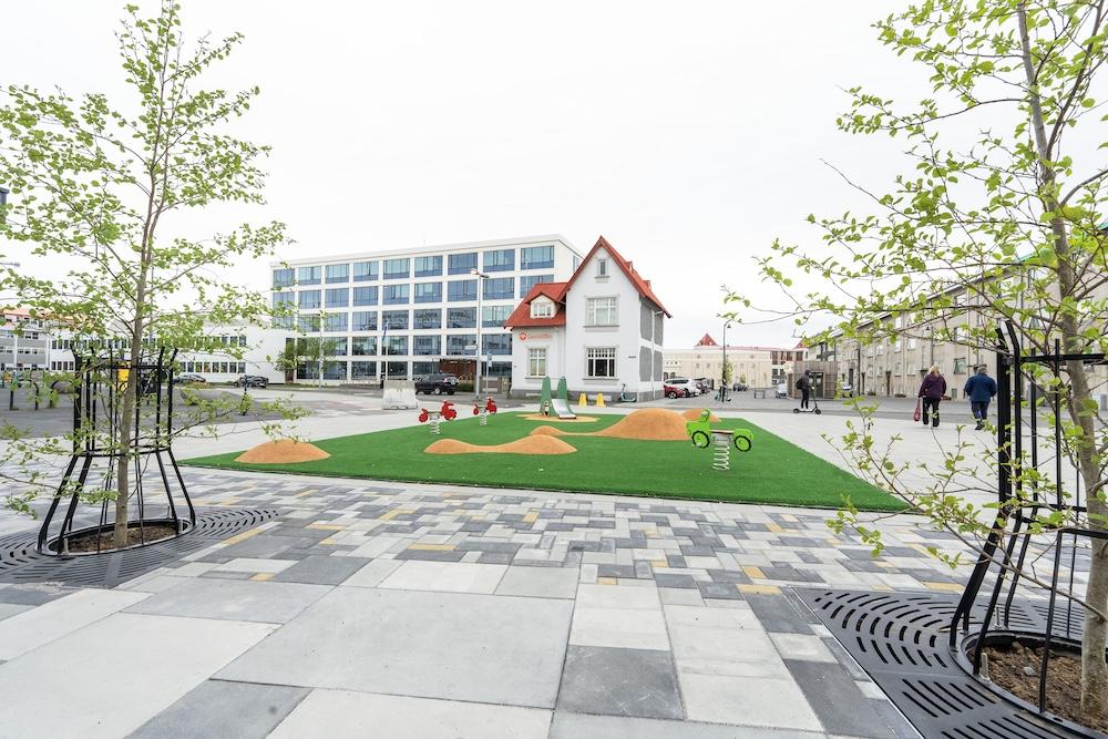 playground, trees and building