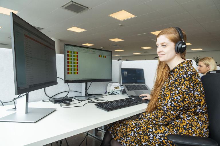 Laufey Dóra Áskelsdóttir, doctor and project manager at the Welfare Technology Living Lab, sits at a computer in Reykjavík City's virtual service center.
