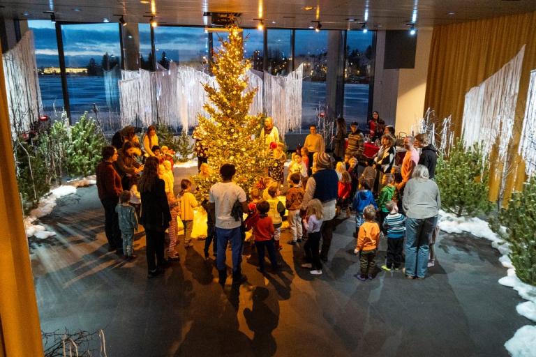 Walking around the Christmas tree in the Christmas Forest at Reykjavík City Hall