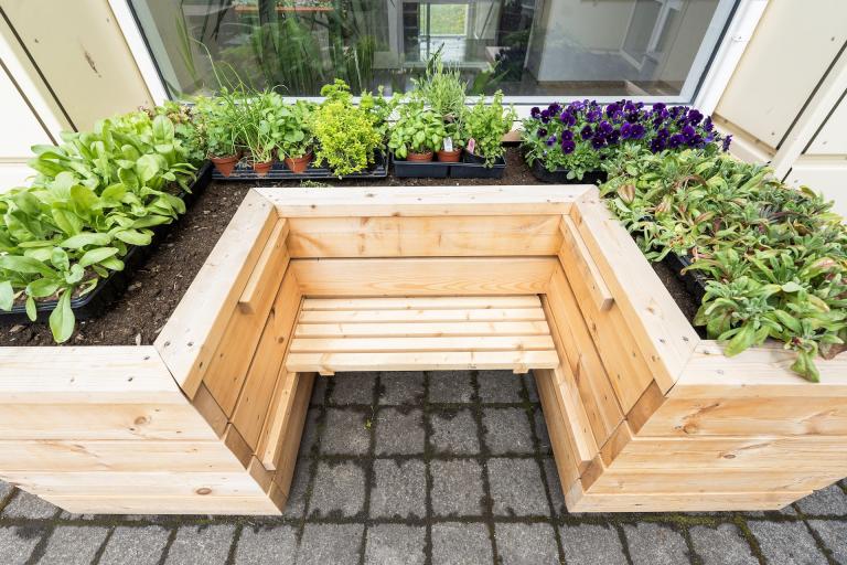 Planter boxes for standing or sitting while gardening.