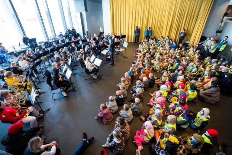 Ingi Garðar, music director, conducting the Vesturbær and Miðbær school band at a concert in Reykjavík City Hall.