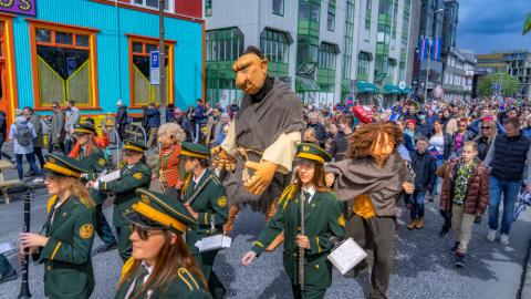 Tufti, along with a brass band and national holiday guests, in a parade on June 17, 2022.