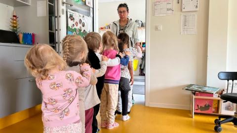 Children lined up at a preschool.