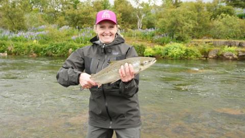 Mayor Heiða Björg Hilmisdóttir with the salmon she caught at this morning's opening of the Elliðaár rivers.