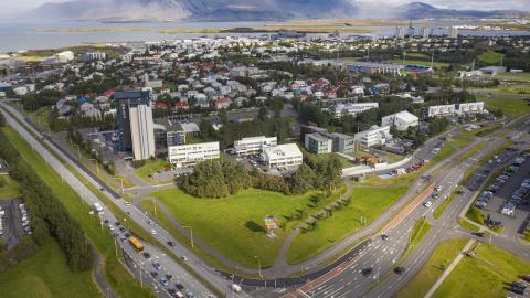 Intersections, biking paths, streets, buildings and greenery